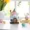 Glitzhome® 8" Lighted Easter Resin Egg-Shaped House Table Decor